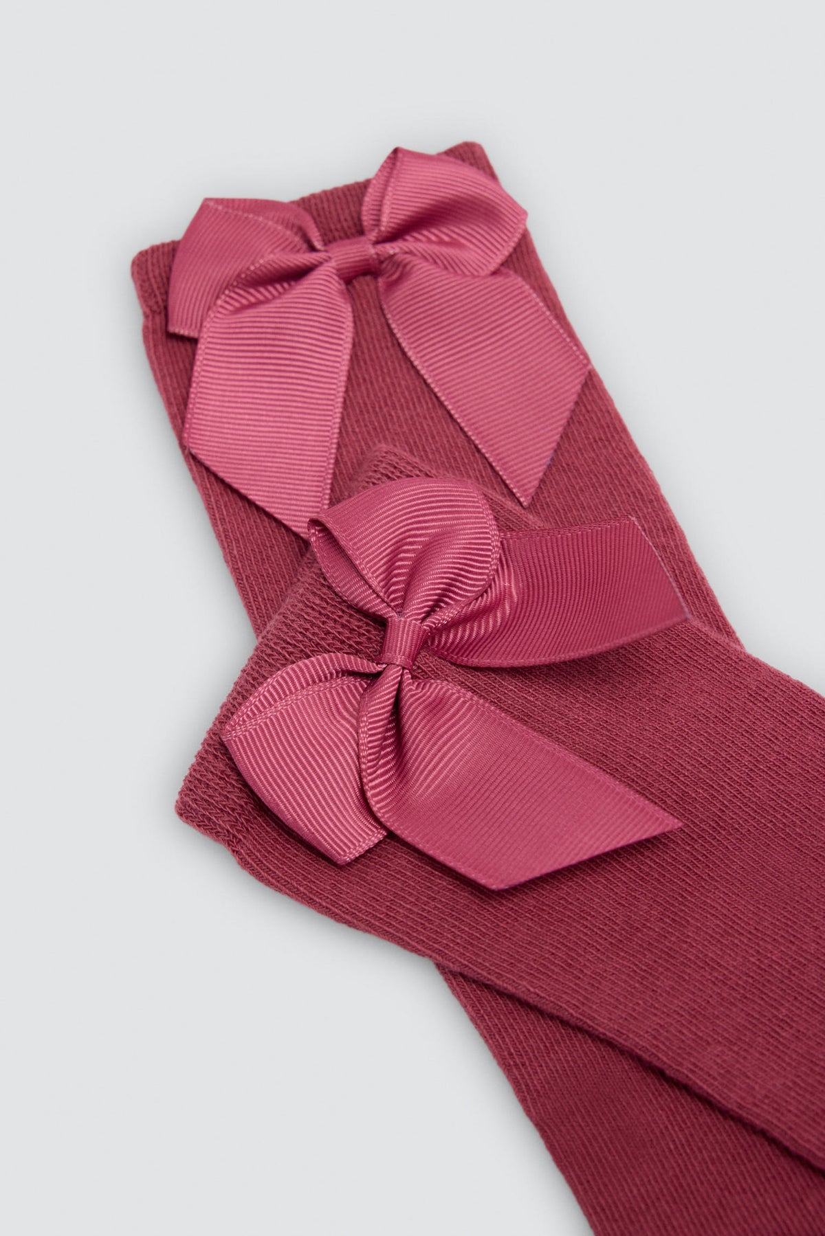 Calzino lungo da bambino con dettaglio fiocco rosa
