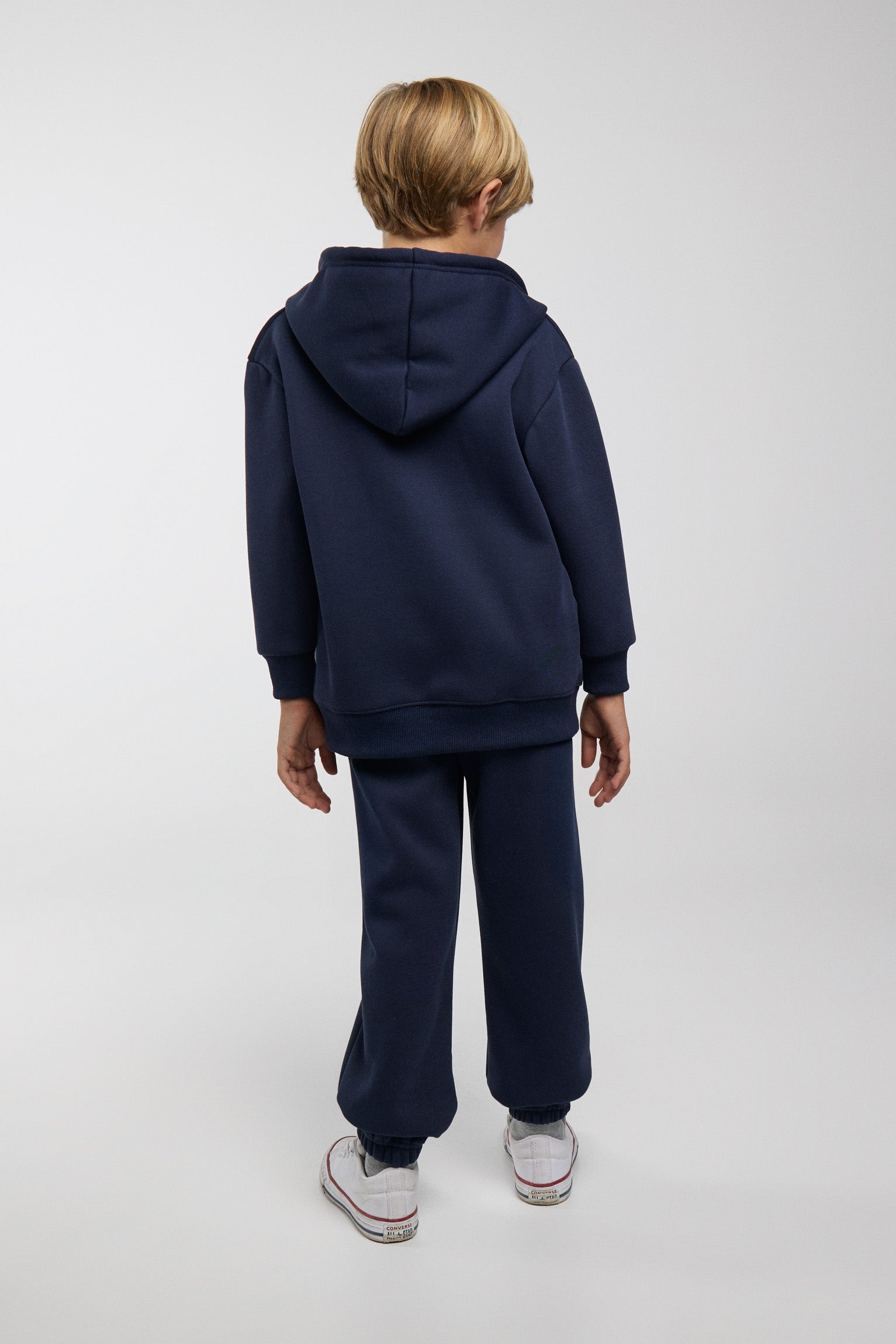 Conjunto de chándal infantil azul marino con chaqueta con capucha y cremallera y pantalón jogger ancho