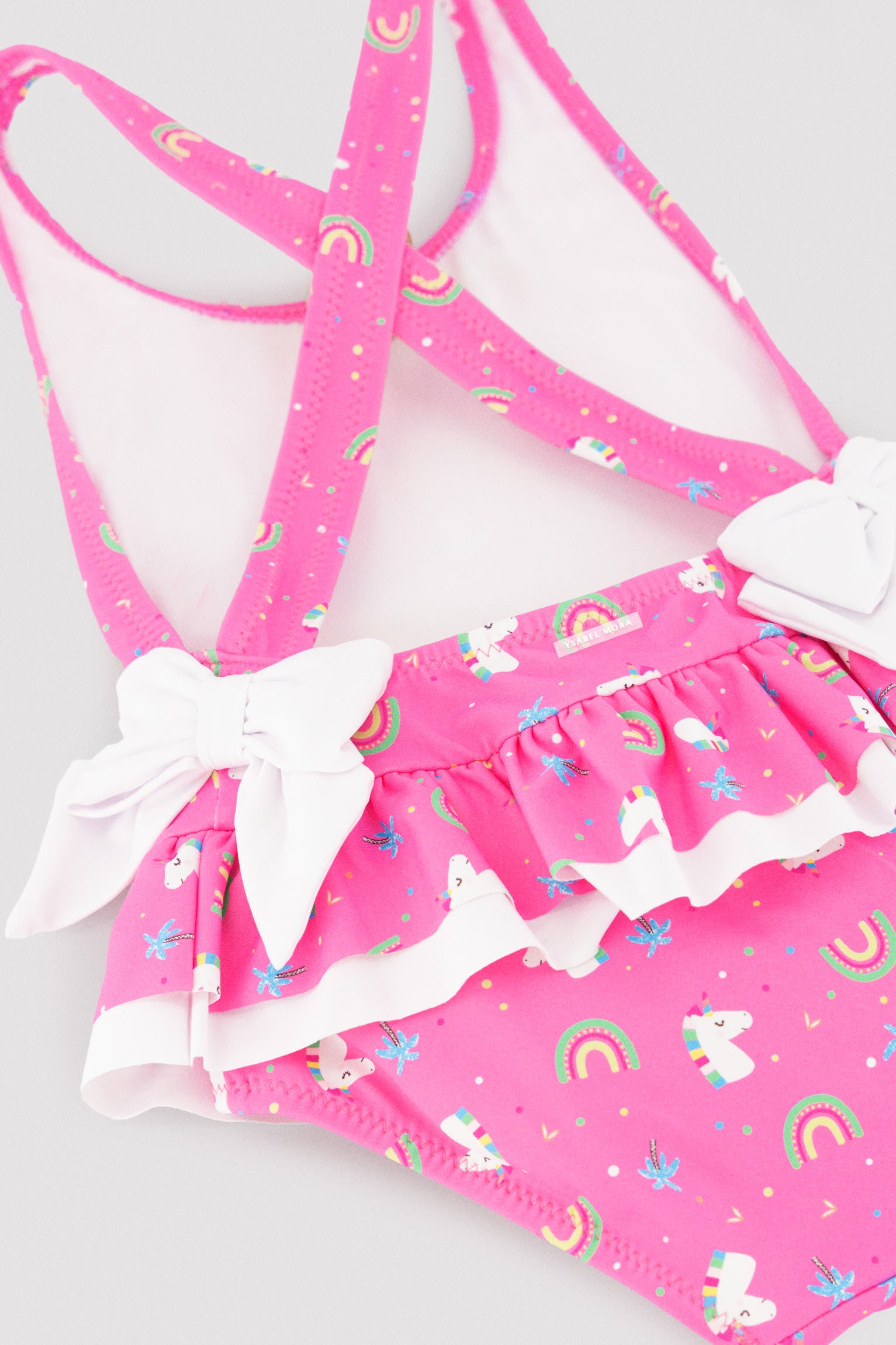 Costume da bagno per bambina con dettagli a balze e fiocchi, stampa unicorno