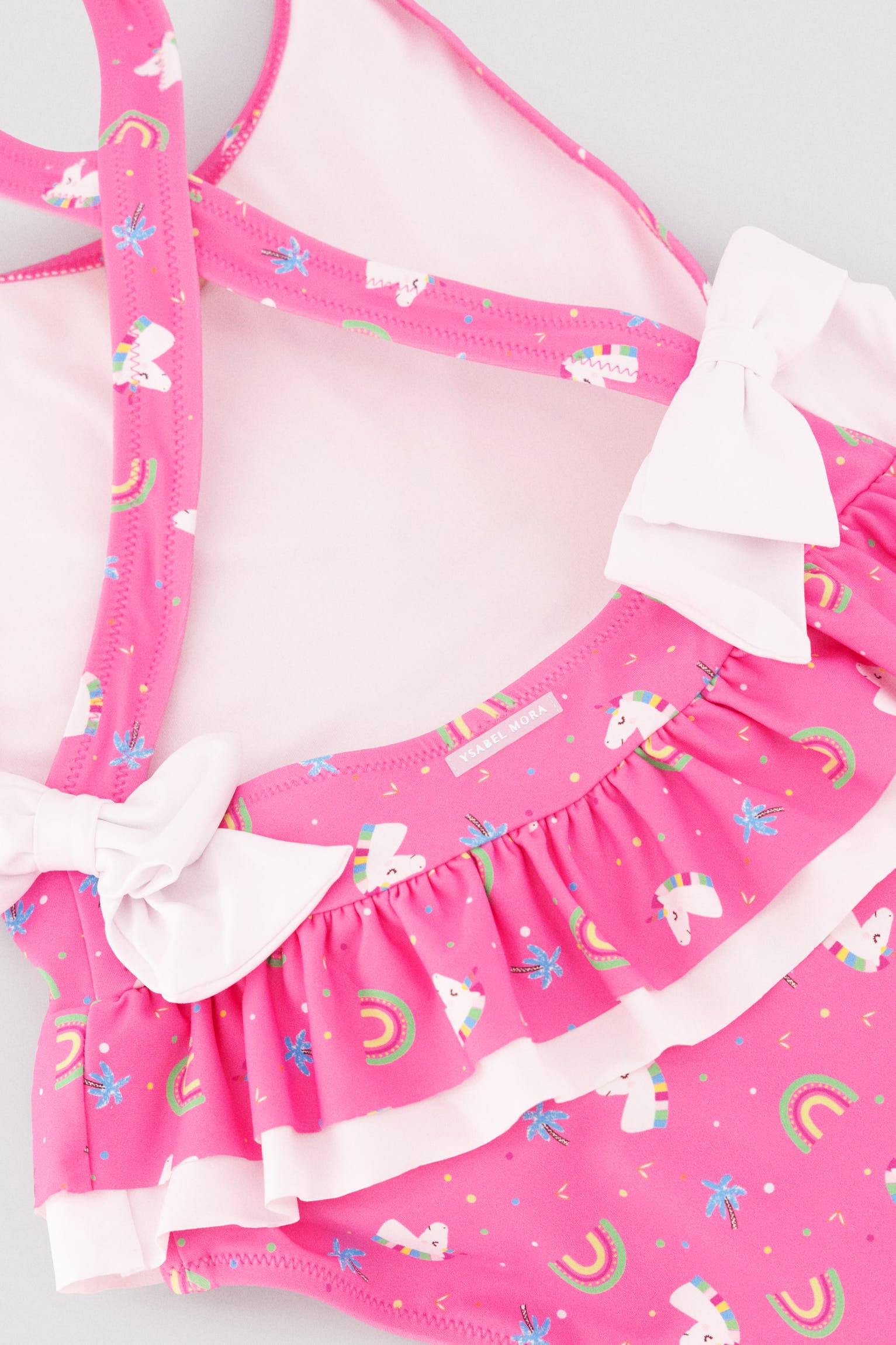 Costume da bagno per bambina con dettagli a balze e fiocchi, stampa unicorno