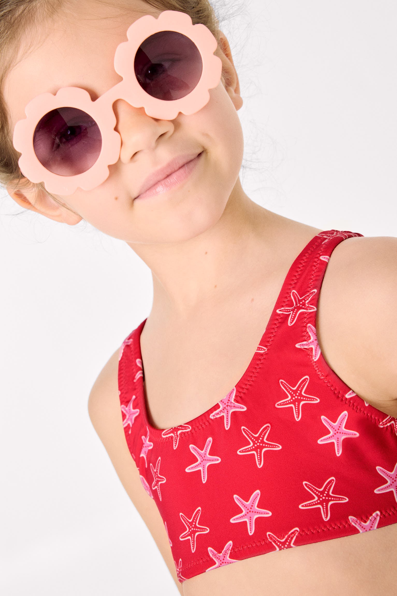 Bikini da bambina con dettagli a balze e fiocchi, stampa a stelle marine