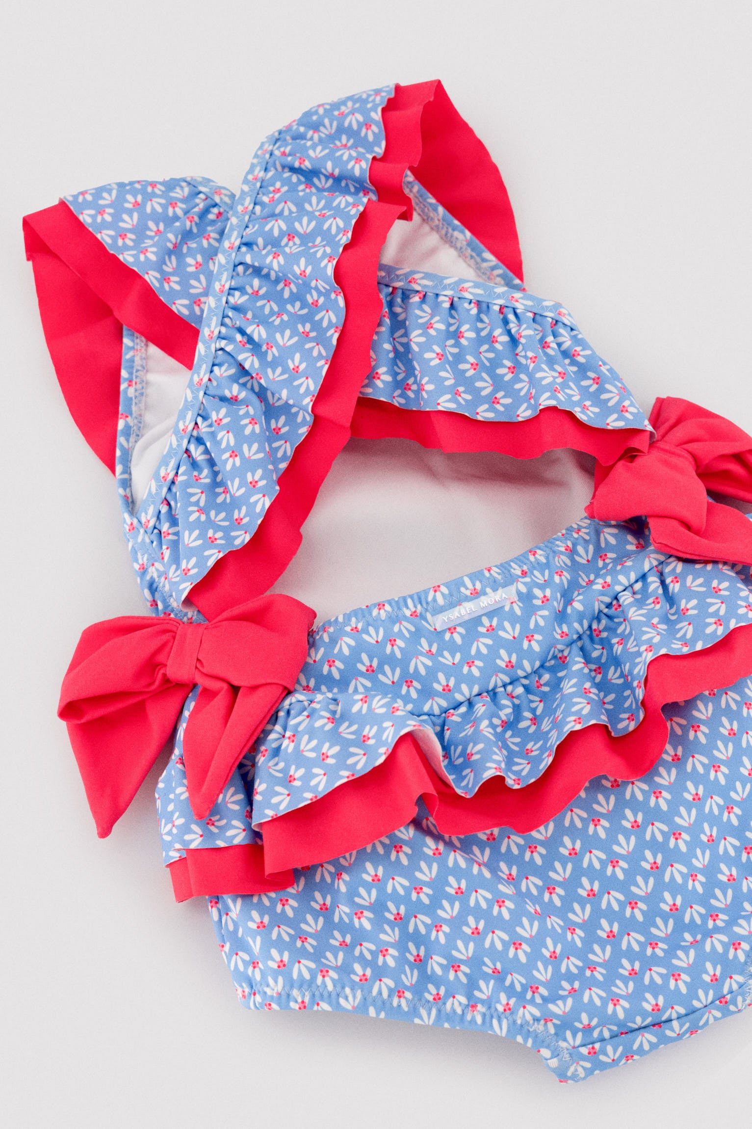 Bañador bebé niña detalles volantes y lazos estampado flores - Ysabel Mora