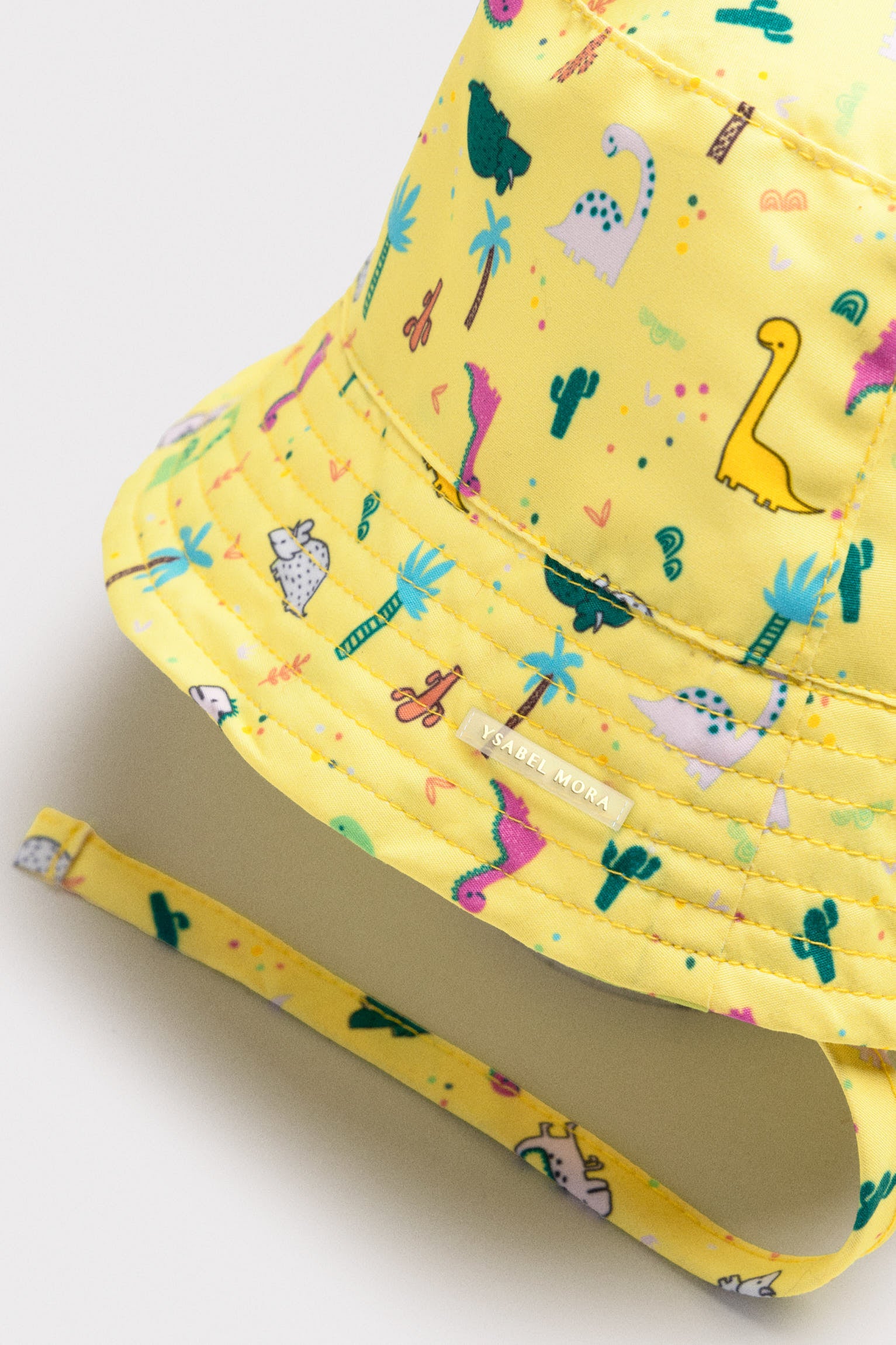 Gorro de playa bebé ala recta estampado dinosaurios - Ysabel Mora