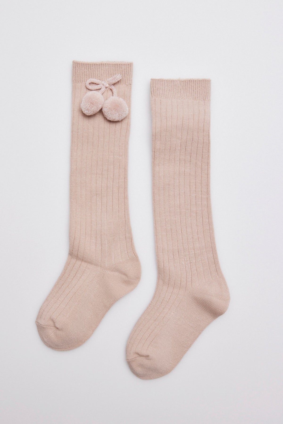 Calcetín bambino largo detalle pompones beige