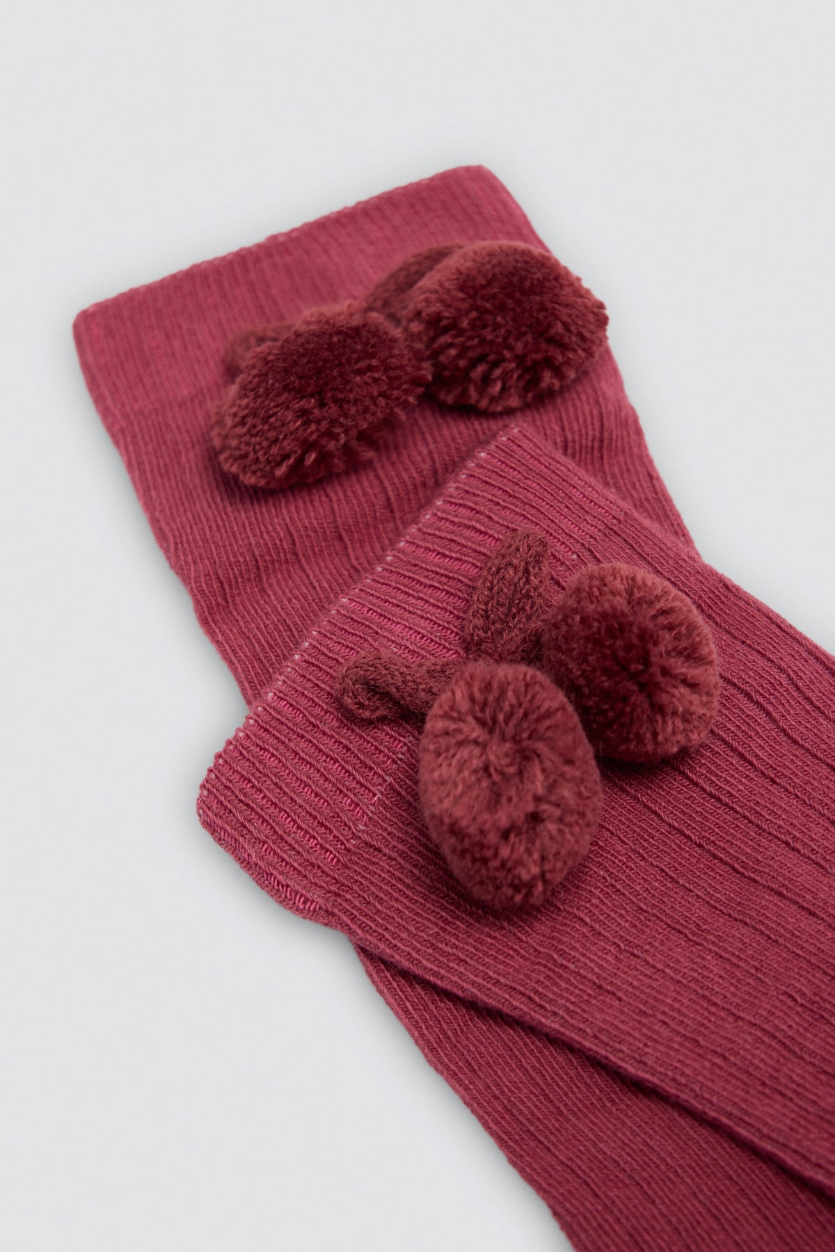 Calcetín bambino largo detalle pompones rosa
