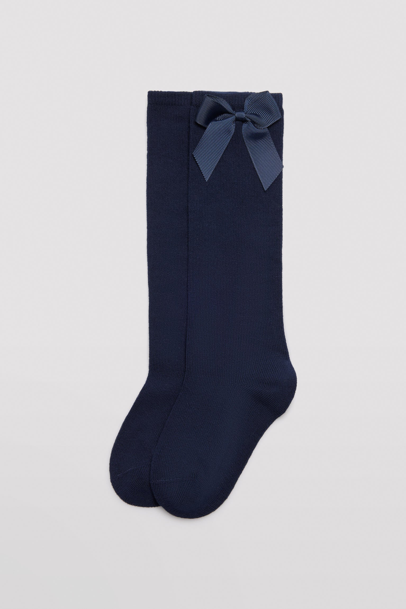 Calzino lungo da bambino con dettaglio fiocco blu navy