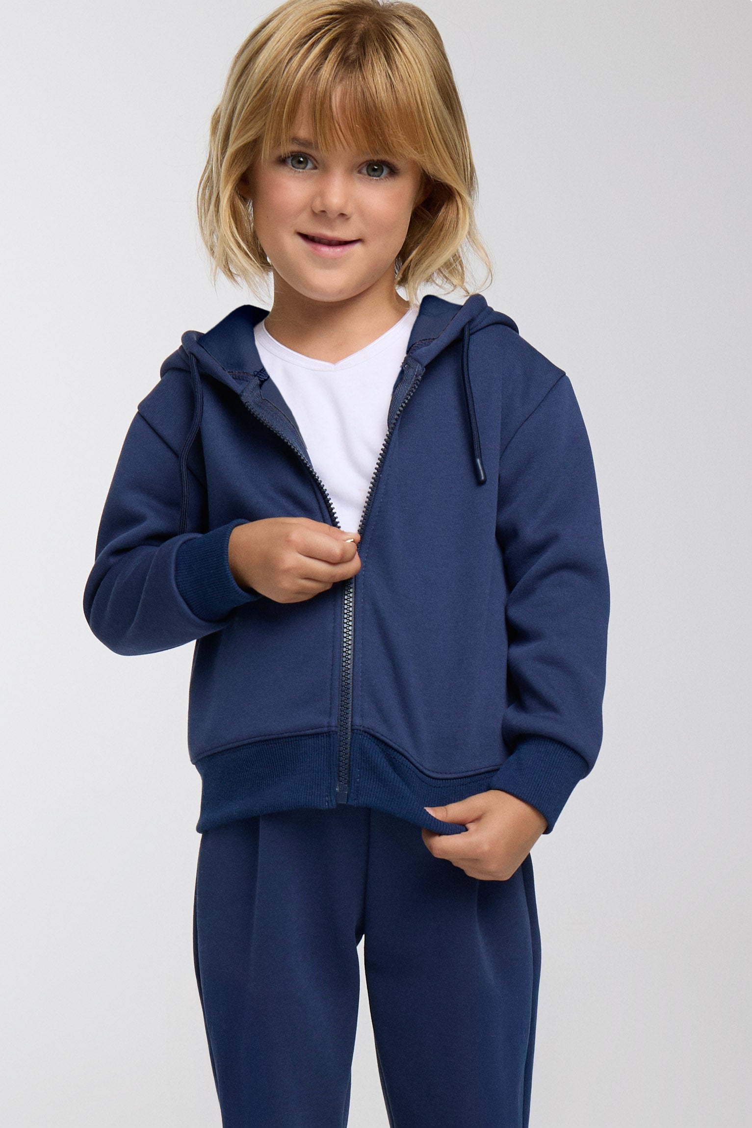 Conjunto de chándal infantil azul marino con chaqueta con capucha y cremallera y pantalón recto
