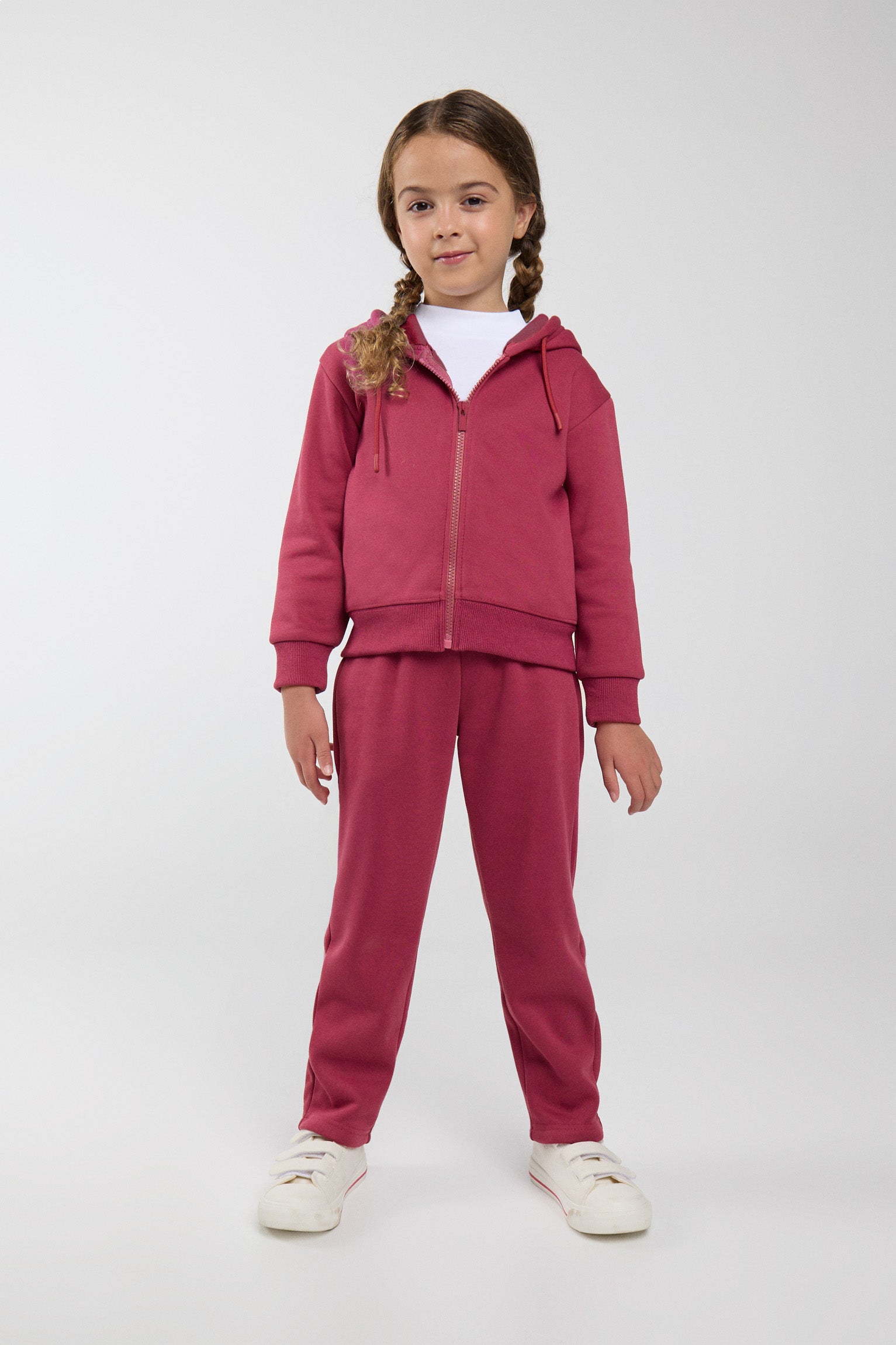 Chándal deportivo de niña afelpado con chaqueta con capucha y cremallera y pantalón recto en color rosa